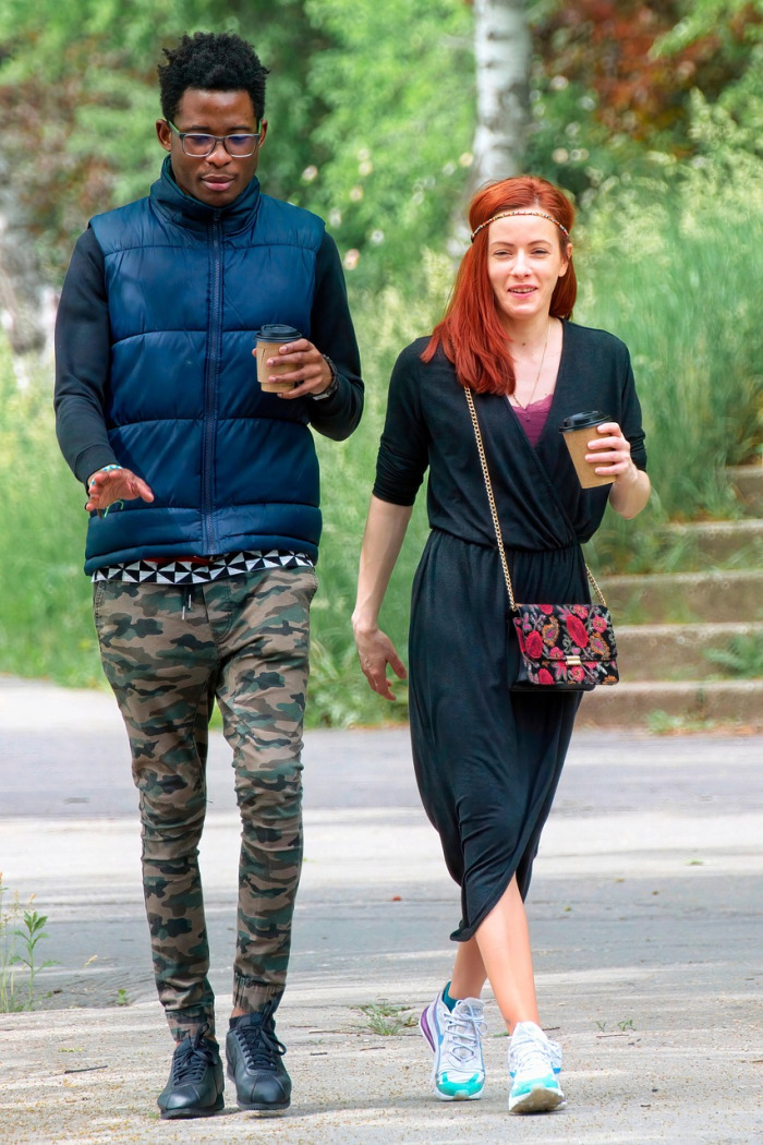 black couple walking park well-being